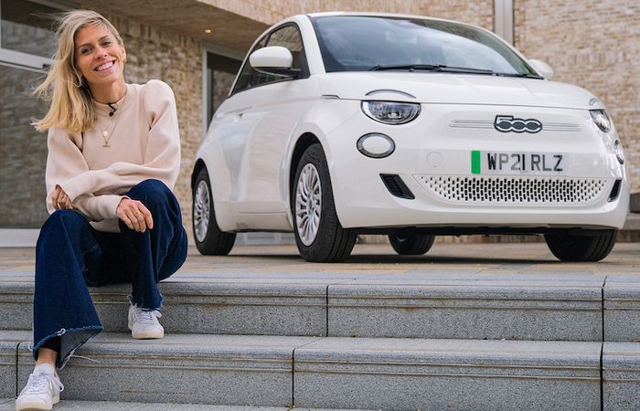Nicki Shields with a white Fiat 500e